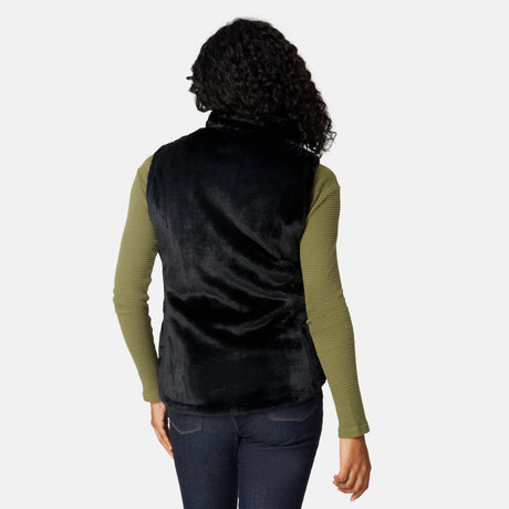[Angelique is 5'10" wearing size S.] Person wearing a black vest over a green long-sleeve shirt on a white background