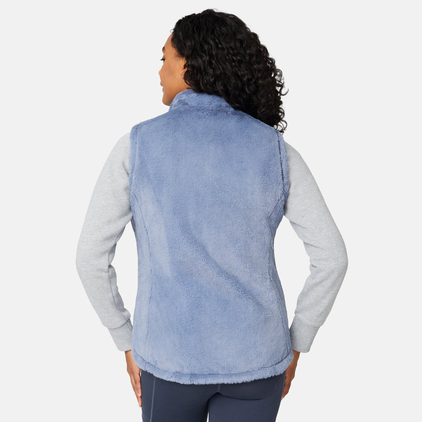 [Angelique is 5'10" wearing size S.] Person wearing a light blue fleece vest over a gray shirt on a white background