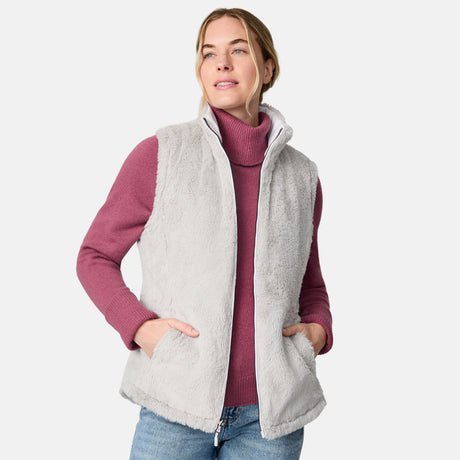 [CJ is 5'10" wearing size S.] Woman wearing a white quilted vest over a pink long-sleeve shirt on a white background