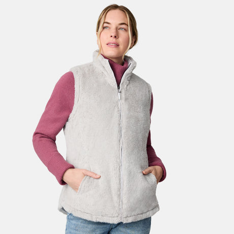 [CJ is 5'10" wearing size S.] Woman wearing a light gray vest over a pink long-sleeve shirt on a white background