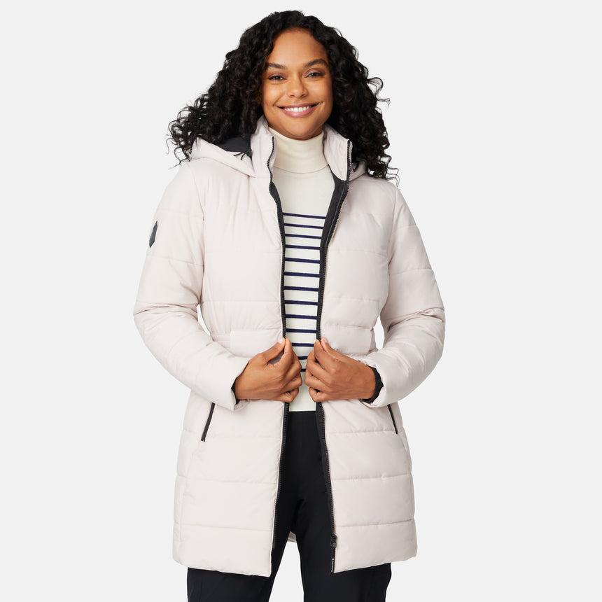 [Angelique is 5'10" wearing size S.] Woman wearing a white long puffer coat with black accents on a white background