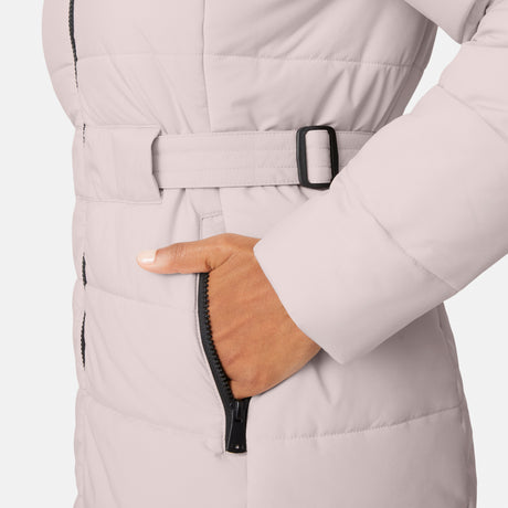[Angelique is 5'10" wearing size S.] Close-up of a person wearing a white puffer coat with a belt and black zipper details.