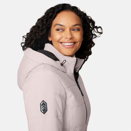[Angelique is 5'10" wearing size S.] Woman wearing a white long puffer coat with black accents on a white background