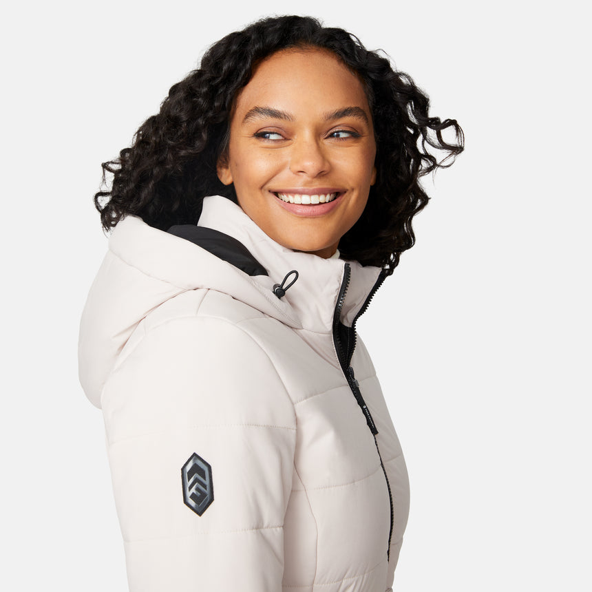 [Angelique is 5'10" wearing size S.] Woman wearing a white long puffer coat with black accents on a white background
