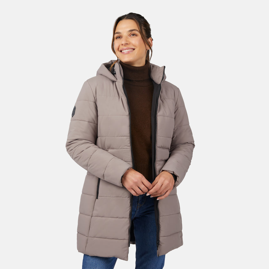 [Olga is 5'9" wearing size S.] Woman wearing a beige puffer coat on a white background