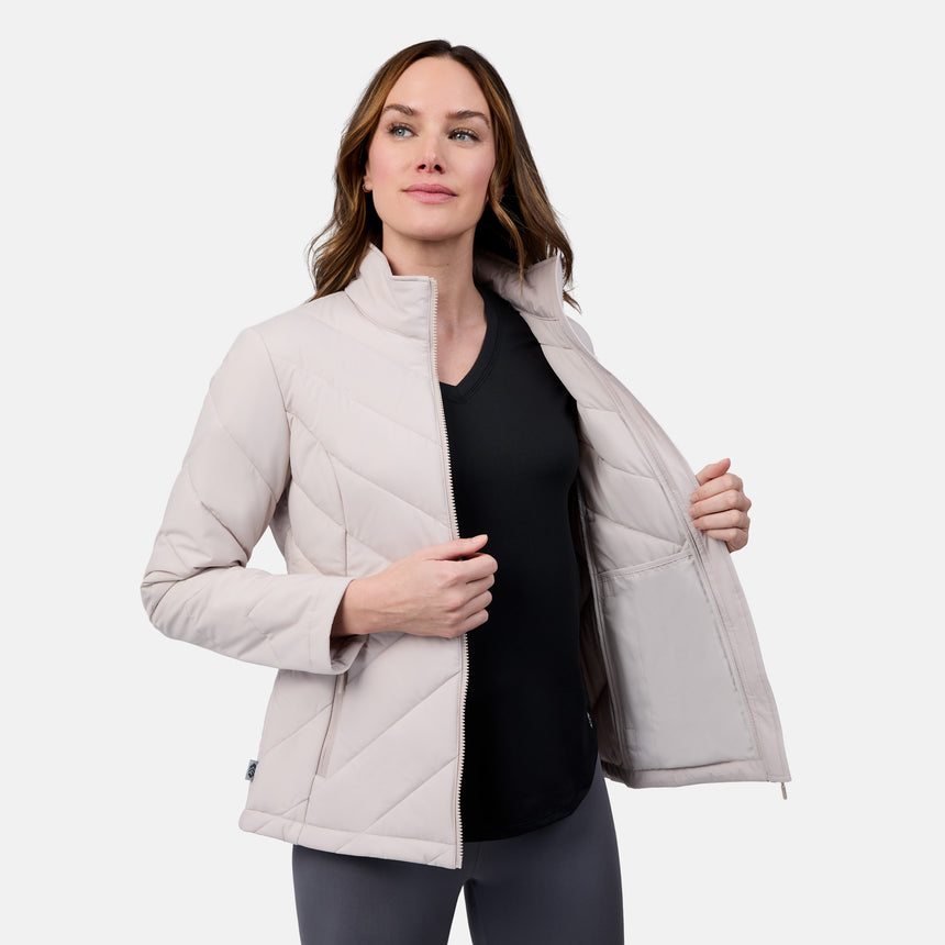 [Emily is 5'9" wearing size S] Woman wearing a light gray quilted jacket on a white background