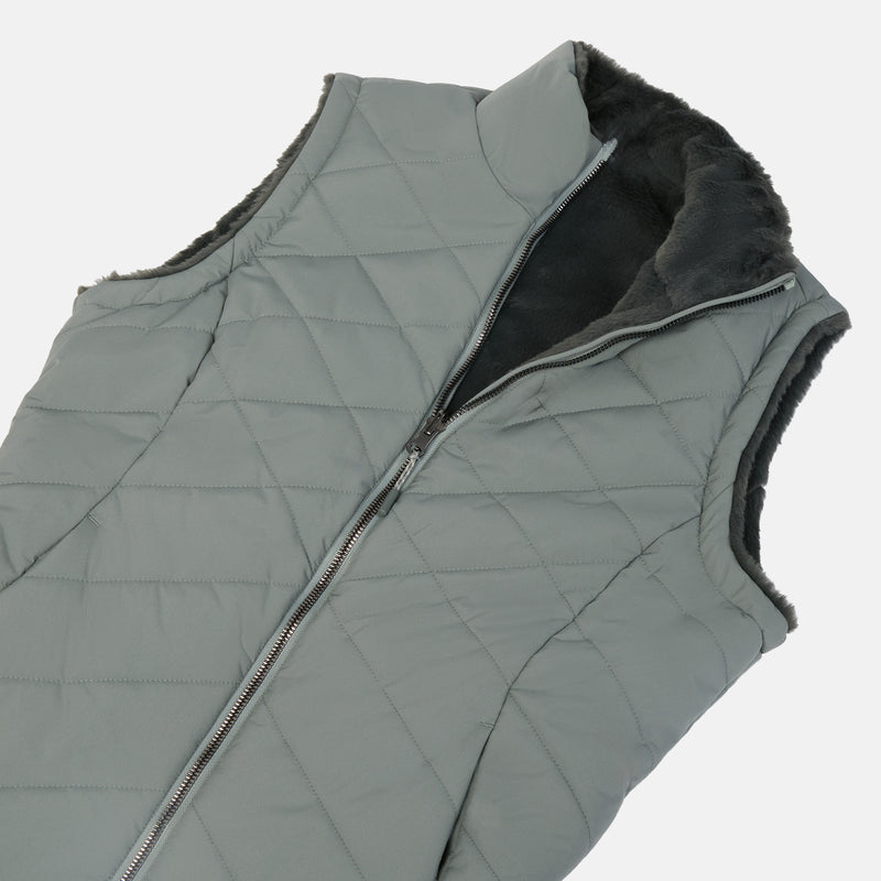 A sleeveless quilted puffer vest in a muted gray-green color, featuring a black faux-fur collar lining and a front zipper closure, shown against a plain light gray background.