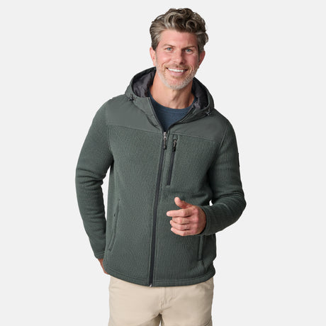 [Kolby is 6'2" wearing size M.] Men’s Free Country green hooded jacket with full-zip front, zippered chest pocket, and dual side hand pockets—featuring textured fabric and a clean outdoor silhouette. Paired with beige pants for a rugged, cool-weather look.
