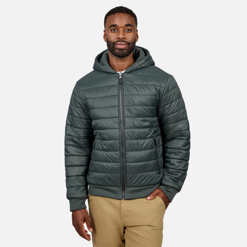 Head-on portrait of man in a dark green hooded fleece jacket with zipper, hood up, white T-shirt visible.
