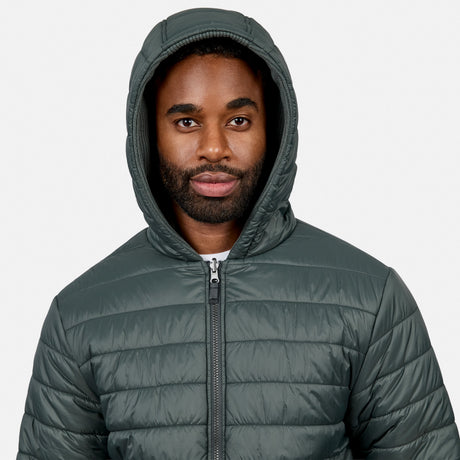 Close-up of a man wearing the dark green Chayote Cable Fleece Reversible Jacket with hood up and front zipper.
