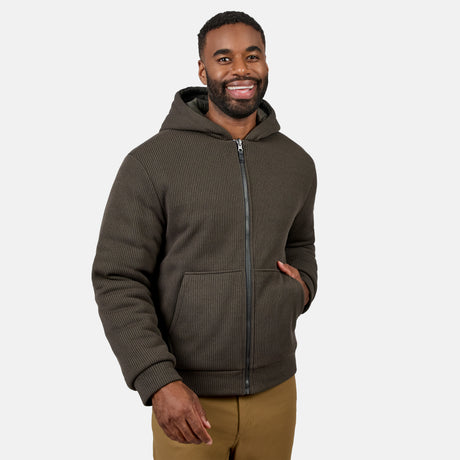 Man wearing Men's Chayote Cable Fleece Reversible Jacket in dark brown ribbed knit with hood