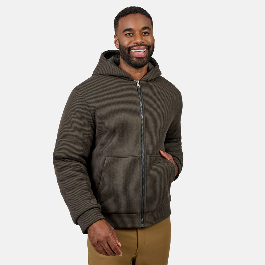 Man wearing Men's Chayote Cable Fleece Reversible Jacket in dark brown ribbed knit with hood
