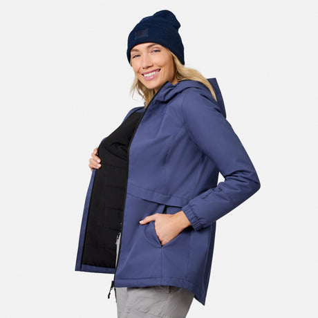 [Model is wearing size S.] Smiling woman wearing a navy X2O Thermo Rain Jacket with a black front panel and a navy knit beanie