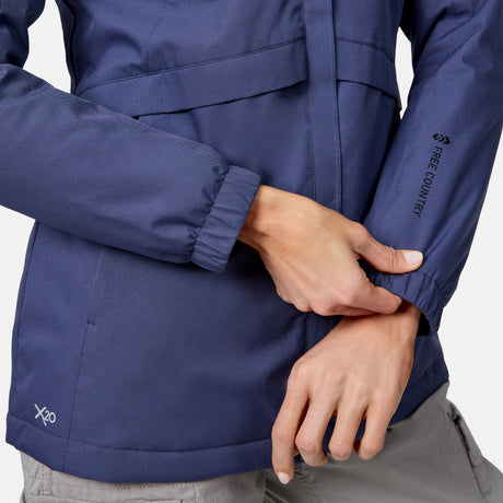 [Model is wearing size S.] Close up of navy X2O Thermo Rain Jacket showing sleeve with vertical text on the forearm
