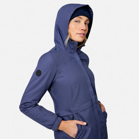 [Model is wearing size S.] Close side view of a woman in a navy X2O Thermo Rain Jacket with hood up
