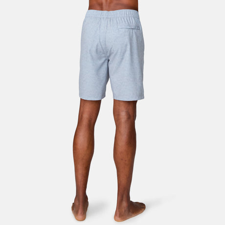 [Anderson is 6'2" wearing a size Medium.] Man wearing Free Country Men's Textured Surf Swim Short in Iron, size M, made from moisture wicking stretch performance fabric featuring a half back elastic waistband and fly front drawstring front closure #color_iron
