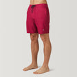 [Model is wearing a size Medium.] Men's Textured Solid Cargo Surf Swim Short - Red - M #color_red