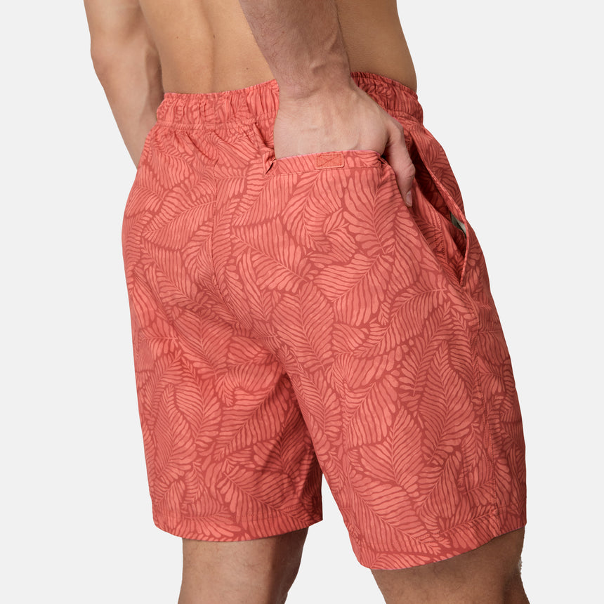 [Model is wearing size M] Red patterned shorts worn by a person on a white background