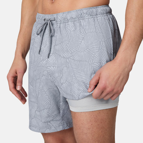 [Model is wearing size M] Gray patterned shorts worn by a person on a white background