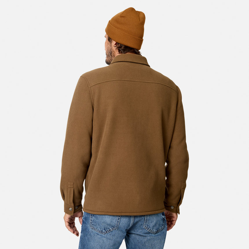 [Model is wearing size M.] A man viewed from behind wearing a brown overshirt, a mustard yellow beanie, and blue jeans against a light gray studio background.