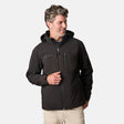 [Kolby is 6'2" wearing size M.] Man wearing Free Country Men's Odyssey II Flex Super Softshell® Jacket in black with a full front zipper opening, adjustable cuff openings, and wind and water resistant stretch performance fabric, light grey background. Perfect men’s jacket for fall weather.
