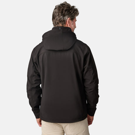[Kolby is 6'2" wearing size M.] Man wearing Free Country Men's Odyssey II Flex Super Softshell® Jacket in black with a full front zipper opening, adjustable cuff openings, and wind and water resistant stretch performance fabric, light grey background. Perfect men’s jacket for fall weather.