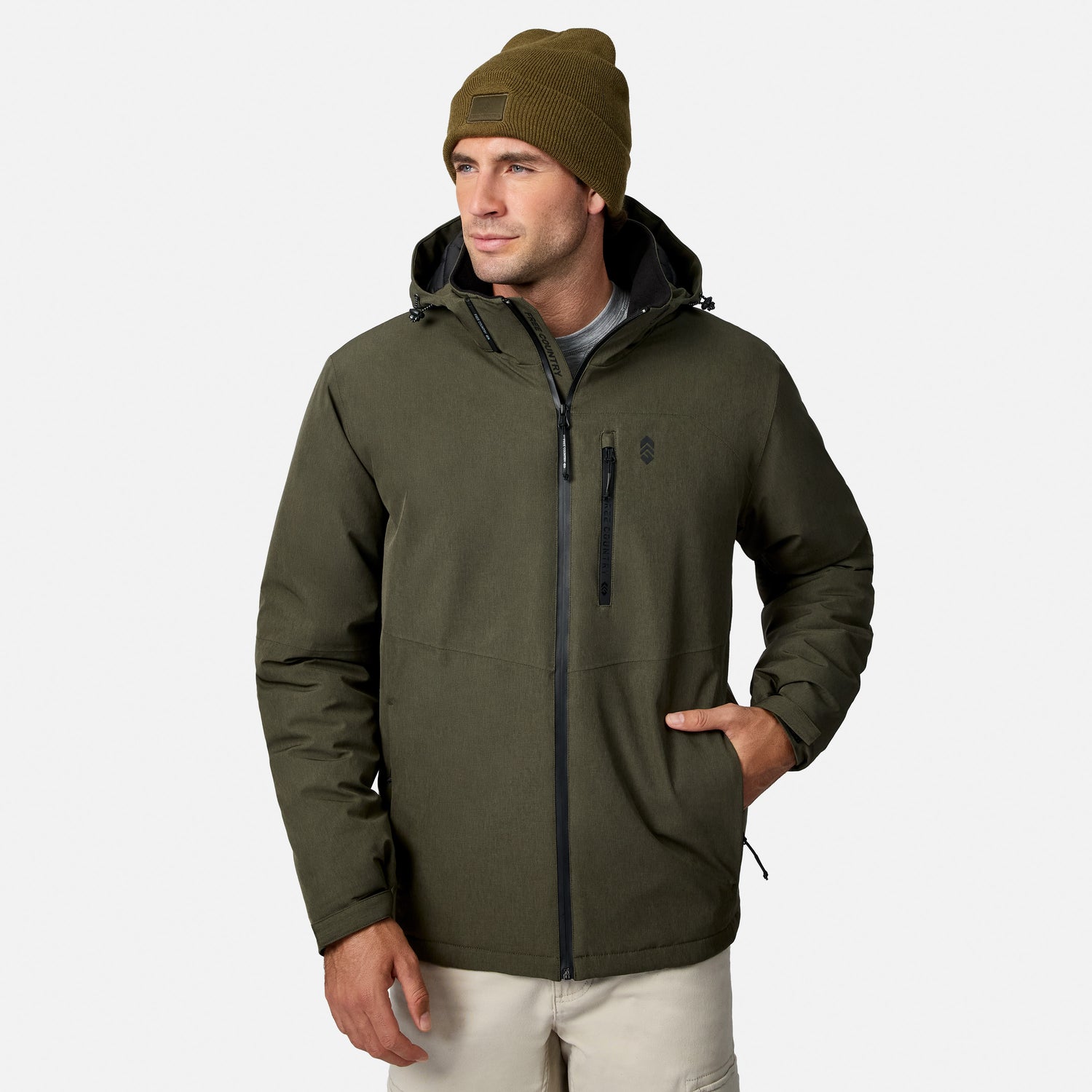 [Model is wearing size M.] A man wearing an olive green hooded jacket, a matching olive beanie, and light beige pants, standing against a light gray studio background.