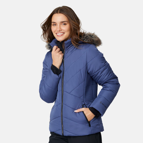 [Jessica is 5'9.5" wearing size S.] Woman wearing a blue puffer jacket with a fur-lined hood on a white background