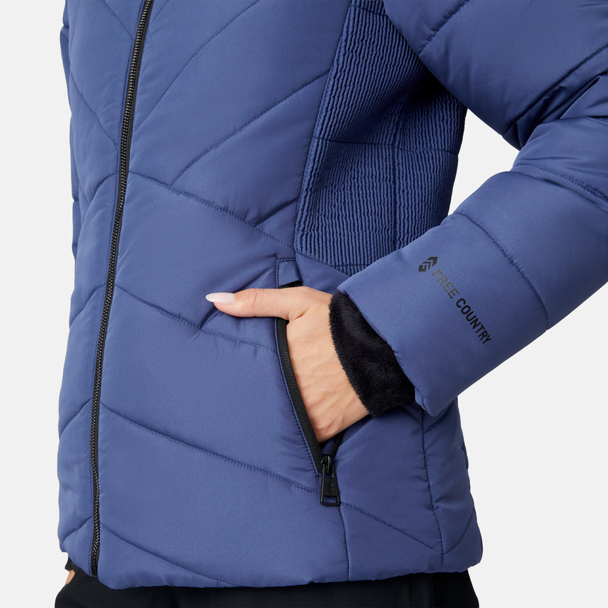 [Jessica is 5'9.5" wearing size S.] Woman wearing a blue puffer jacket with a fur-lined hood on a white background