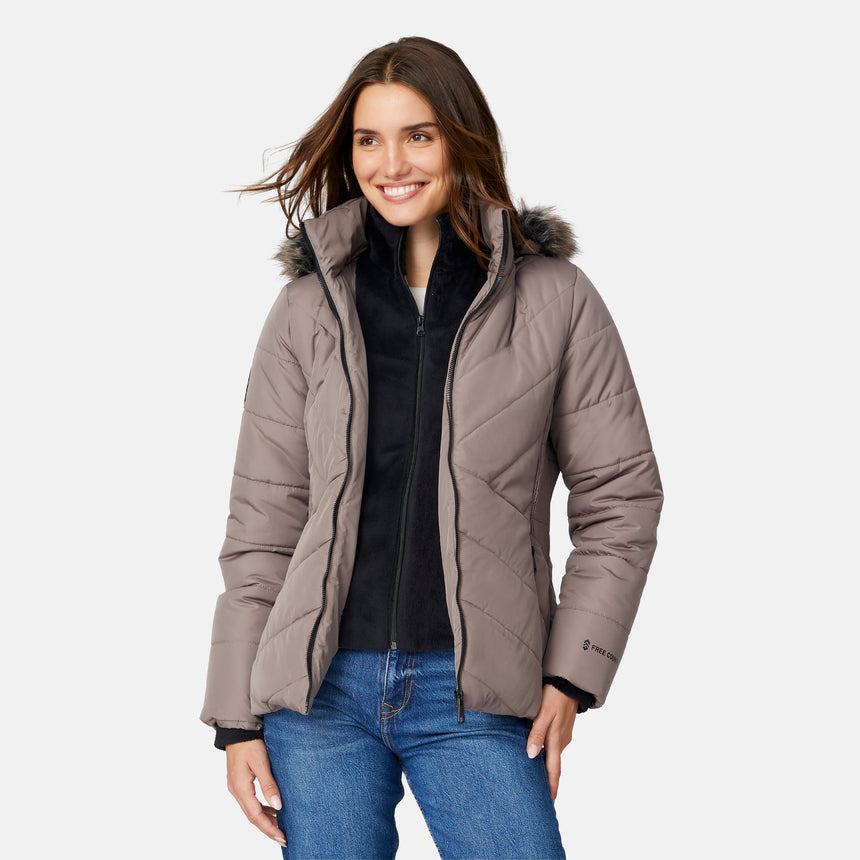 [Jessica is 5'9.5" wearing size S.] Woman wearing a beige quilted jacket on a white background