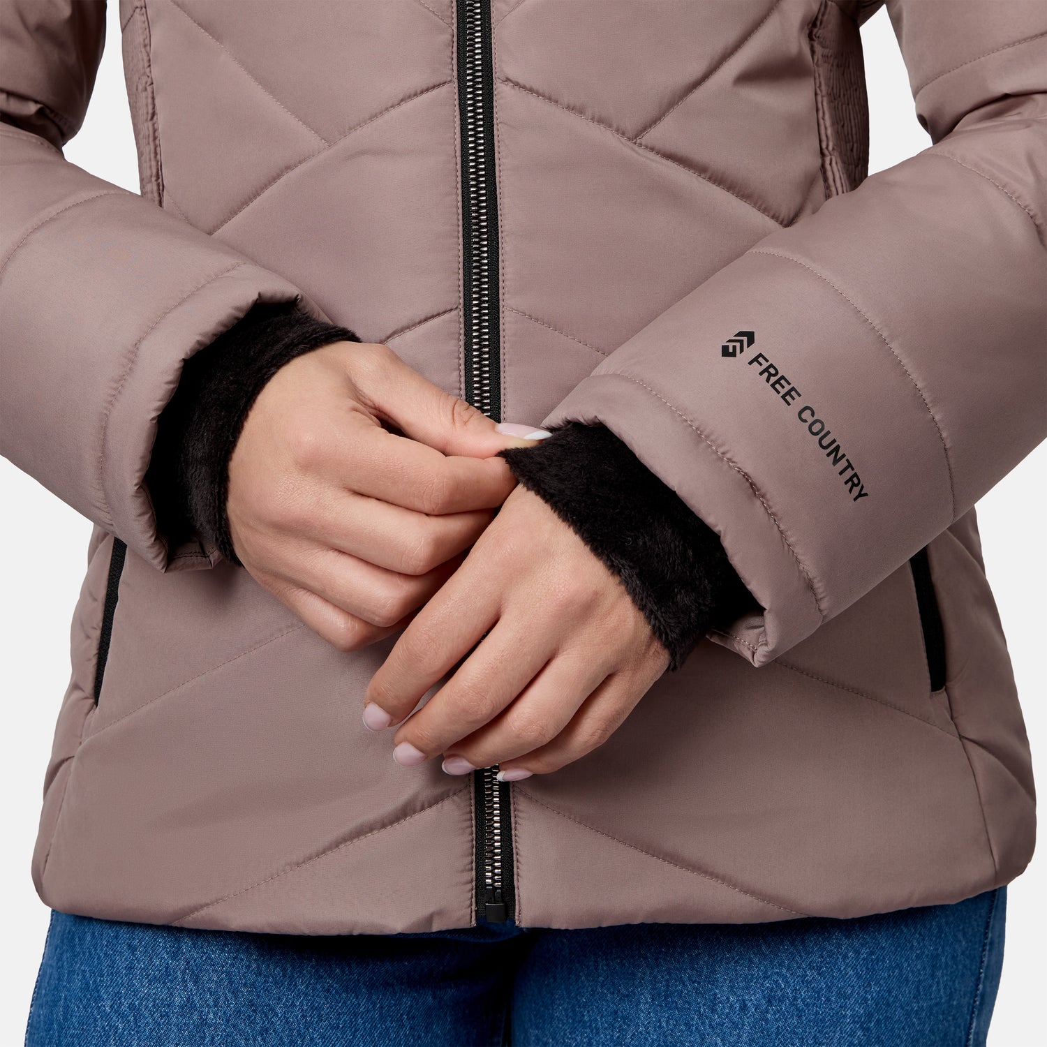 Close-up of a mauve Women’s Brisk II Parka Jacket with a quilted design, black front zipper, and black inner cuffs.