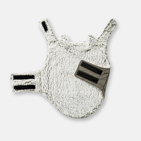 The Clearance Stratus Lite Reversible Dog Jacket, featuring a white sherpa lining, black Velcro straps, and a gray accent panel, is shown laid flat on a white background.