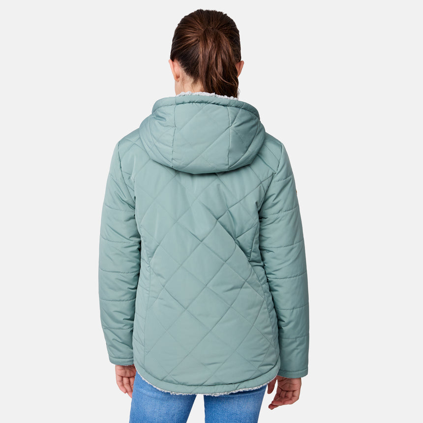 [Samantha is wearing size M] Model wearing a quilted light green Free Country hooded jacket with plush interior lining and full front zip; styled with denim for a relaxed, outdoors-ready look.