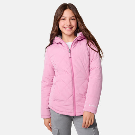 [Samantha is wearing size M] Model wearing a quilted light pink Free Country hooded jacket with diagonal stitching and soft interior lining; casually styled with gray utility pants and a white tee for a laid-back, trail-to-town vibe.