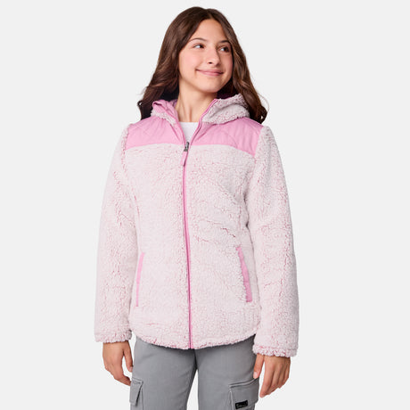 [Samantha is wearing size M] Model wearing a quilted light pink Free Country hooded jacket with diagonal stitching and soft interior lining; casually styled with gray utility pants and a white tee for a laid-back, trail-to-town vibe.
