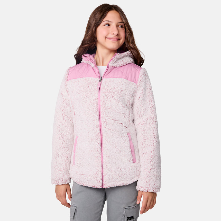 [Samantha is wearing size M] Model wearing a quilted light pink Free Country hooded jacket with diagonal stitching and soft interior lining; casually styled with gray utility pants and a white tee for a laid-back, trail-to-town vibe.