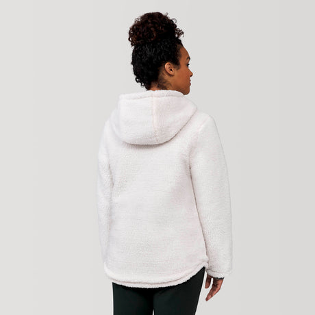 [Alexis is 5’6” wearing a size Small.] Woman wearing Free Country Women's Switch It Up Cloud Lite Reversible Jacket in tan with a full front zipper opening, attached hood with adjustable drawcord, diamond quilting, soft lining, and water resistant and wind resistant stretch performance fabric. light grey background. Perfect women’s  jacket for fall weather.