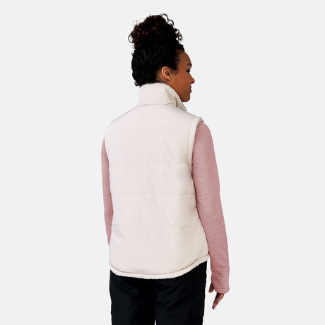 [Alexis is 5’6” wearing a size Small.] Woman wearing the Free Country Women's Venture Stratus Lite Reversible Vest in light gray, featuring a geometric-print Butter Pile® lining and horizontal quilted overlay