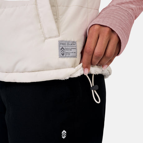 [Alexis is 5’6” wearing a size Small.] Woman wearing the Free Country Women's Venture Stratus Lite Reversible Vest in light gray, featuring a geometric-print Butter Pile® lining and horizontal quilted overlay