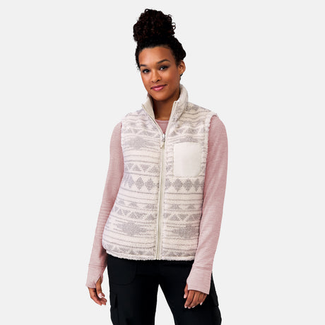 [Alexis is 5’6” wearing a size Small.] Woman wearing the Free Country Women's Venture Stratus Lite Reversible Vest in light gray, featuring a geometric-print Butter Pile® lining and horizontal quilted overlay