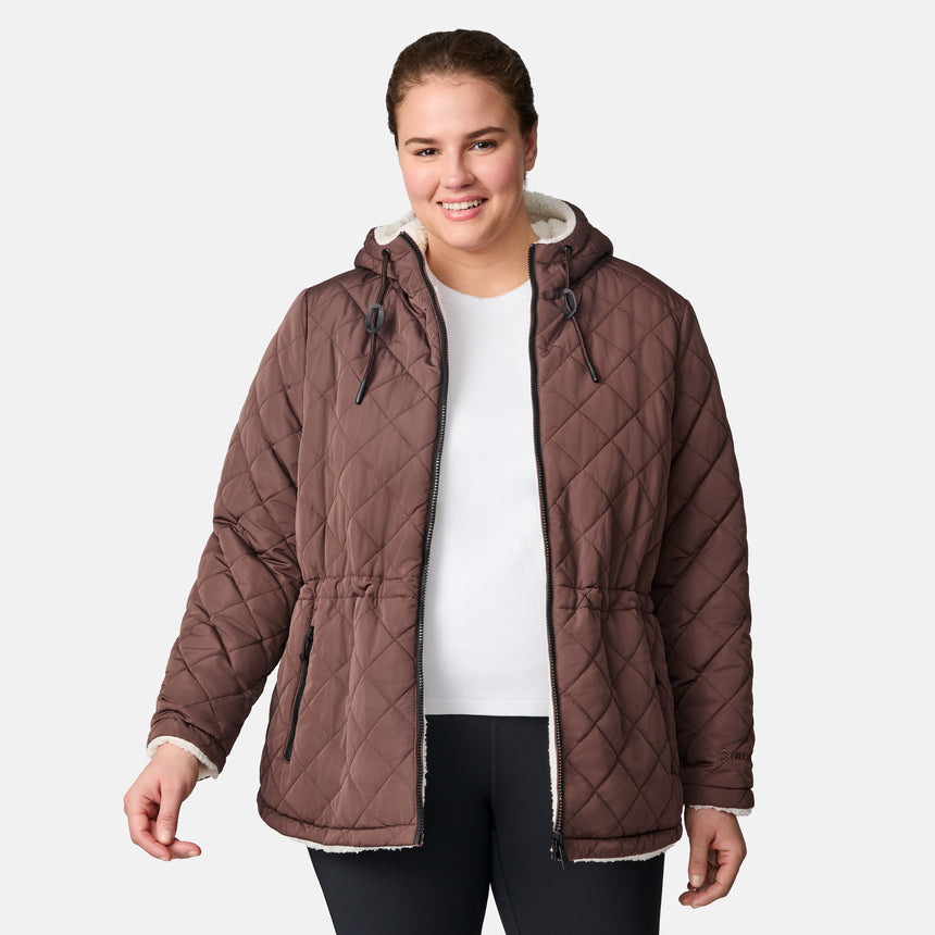 [Karissa is 5’9.5” wearing size 1X.] Women’s quilted brown hooded jacket with diamond pattern, zippered pockets, and drawstring waist — warm, fleece-lined outerwear for cold weather