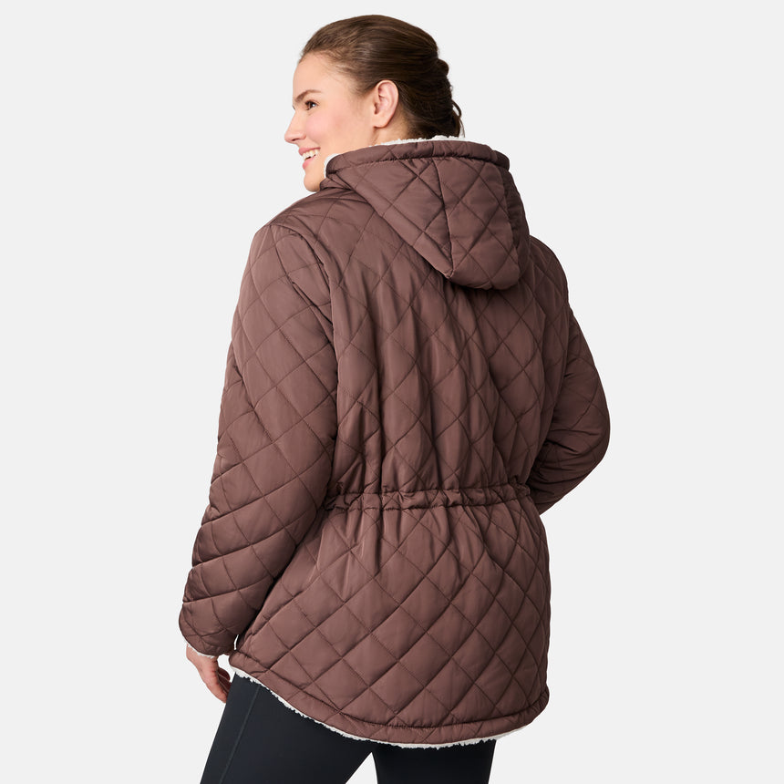 [Karissa is 5’9.5” wearing size 1X.] Women’s quilted brown hooded jacket with diamond pattern, zippered pockets, and drawstring waist — warm, fleece-lined outerwear for cold weather