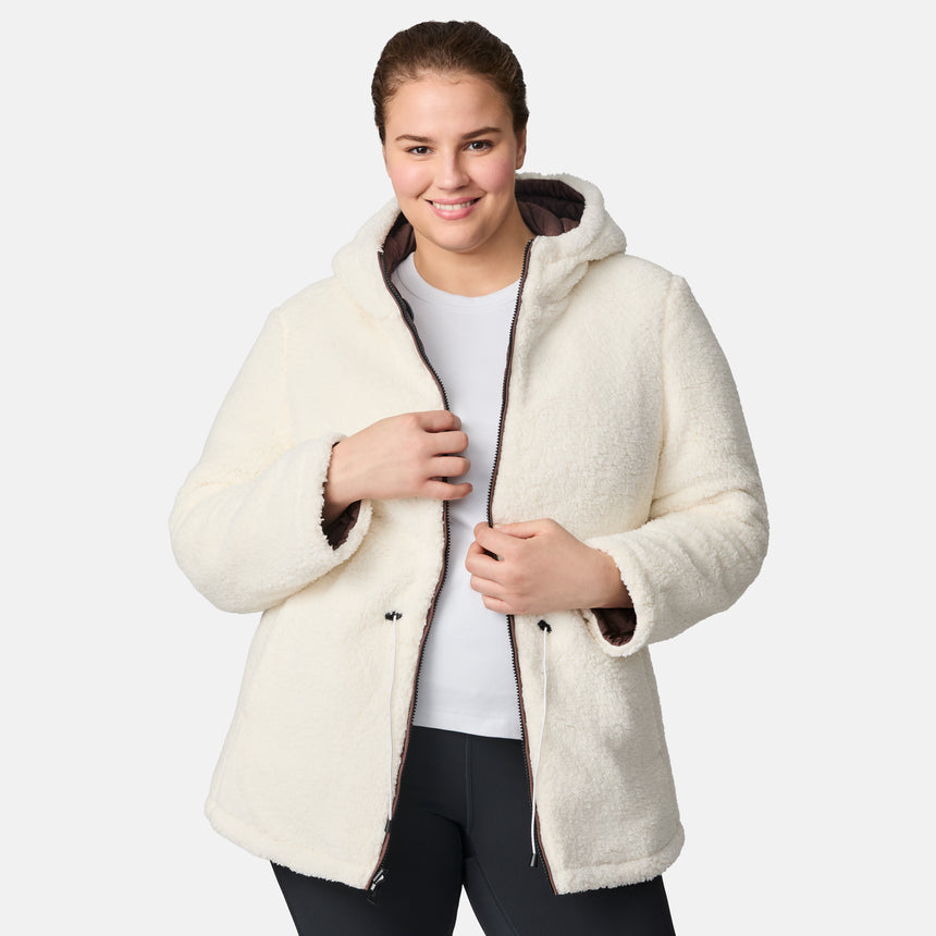 [Karissa is 5’9.5” wearing size 1X.] Women’s quilted brown hooded jacket with diamond pattern, zippered pockets, and drawstring waist — warm, fleece-lined outerwear for cold weather