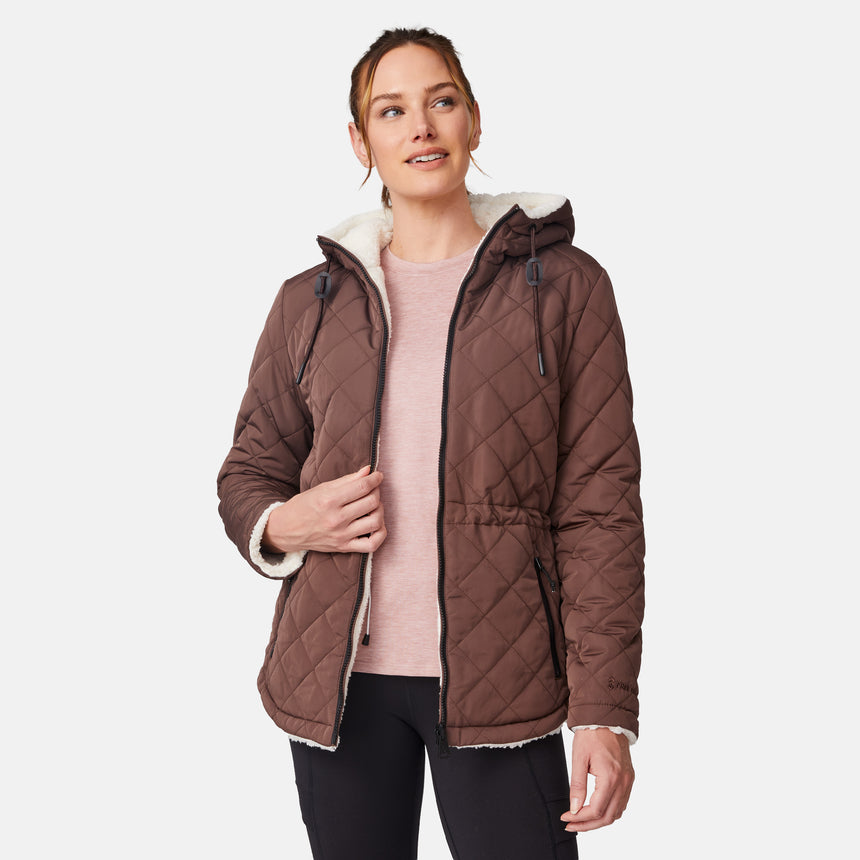 [Emily is 5'9" wearing size S.] Model wearing brown quilted jacket with hood and black pants — reversible design with cream pile interior for cozy, cold-weather layering