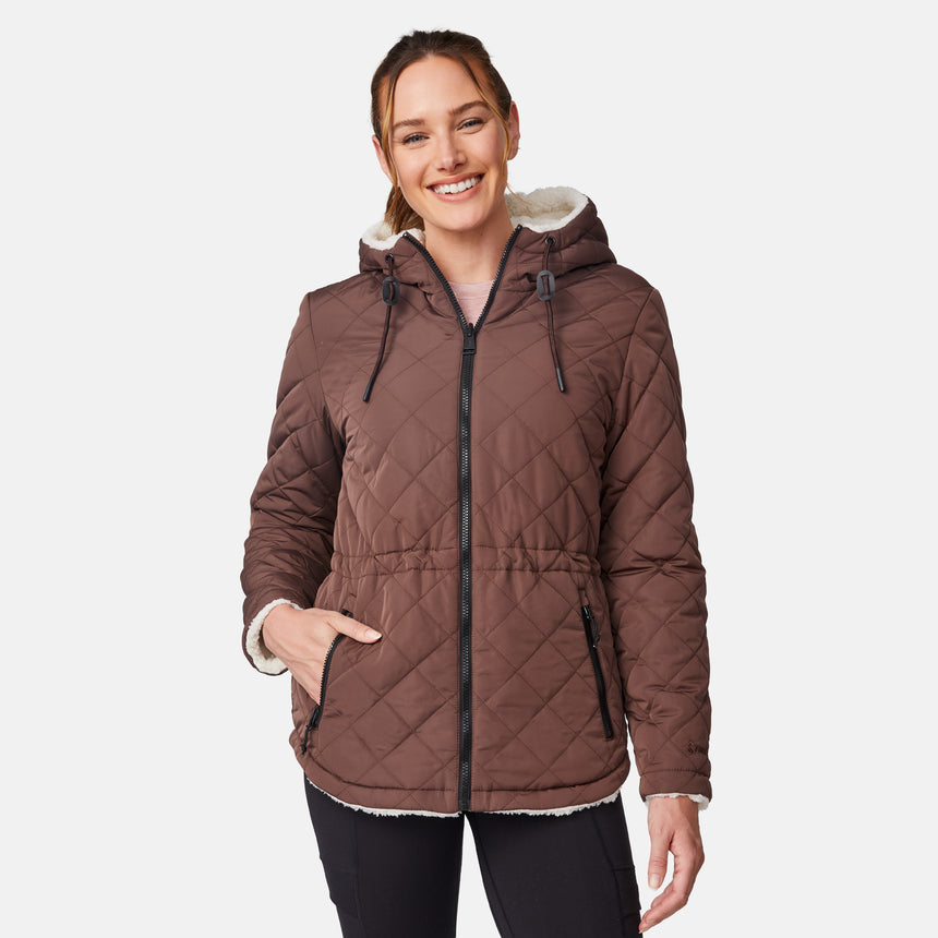 [Emily is 5'9" wearing size S.] Model wearing brown quilted jacket with hood and black pants — reversible design with cream pile interior for cozy, cold-weather layering