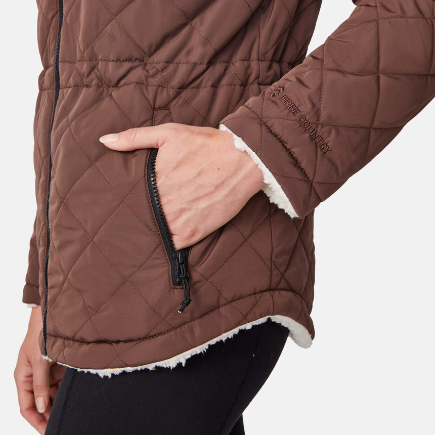 [Emily is 5'9" wearing size S.] Model wearing brown quilted jacket with hood and black pants — reversible design with cream pile interior for cozy, cold-weather layering