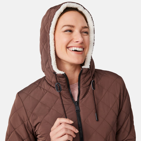 [Emily is 5'9" wearing size S.] Model wearing brown quilted jacket with hood and black pants — reversible design with cream pile interior for cozy, cold-weather layering