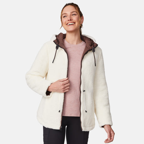 [Emily is 5'9" wearing size S.] Model wearing brown quilted jacket with hood and black pants — reversible design with cream pile interior for cozy, cold-weather layering