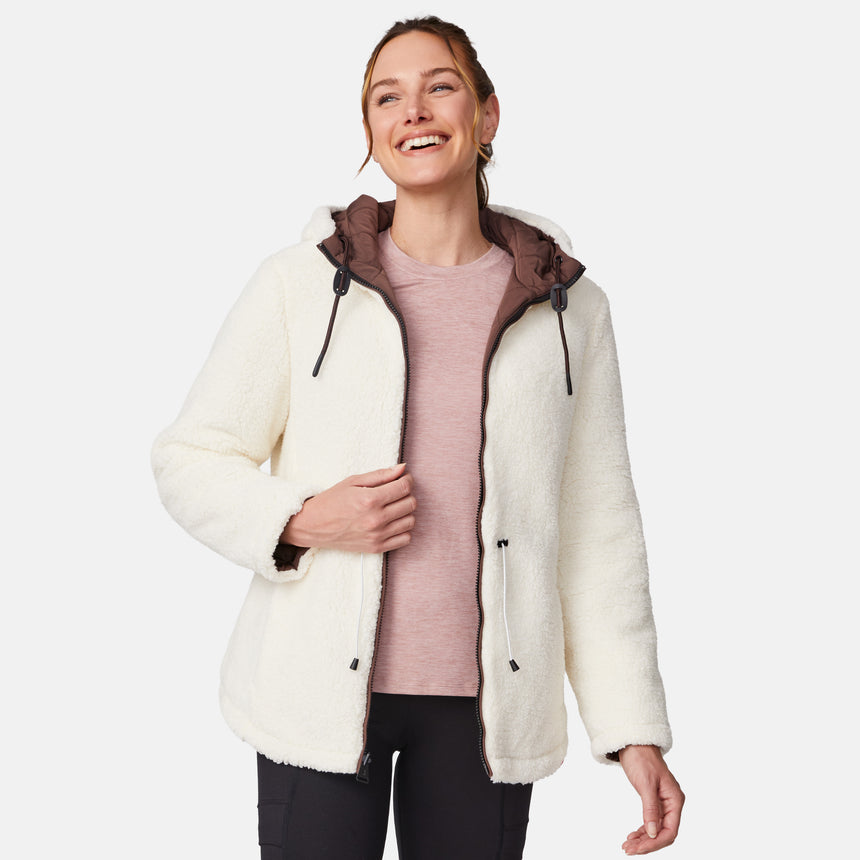 [Emily is 5'9" wearing size S.] Model wearing brown quilted jacket with hood and black pants — reversible design with cream pile interior for cozy, cold-weather layering