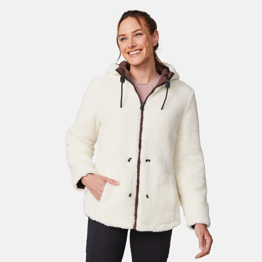 [Emily is 5'9" wearing size S.] Model wearing brown quilted jacket with hood and black pants — reversible design with cream pile interior for cozy, cold-weather layering